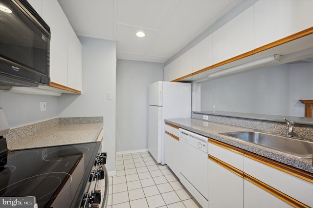 kitchen with white cabinetry, sink, white appliances, and light tile patterned flooring