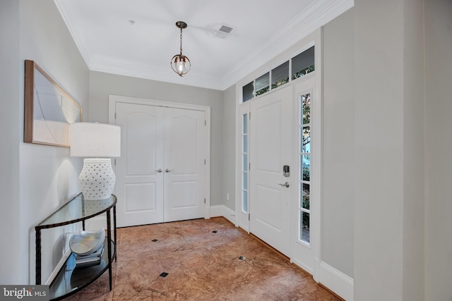 entryway featuring ornamental molding