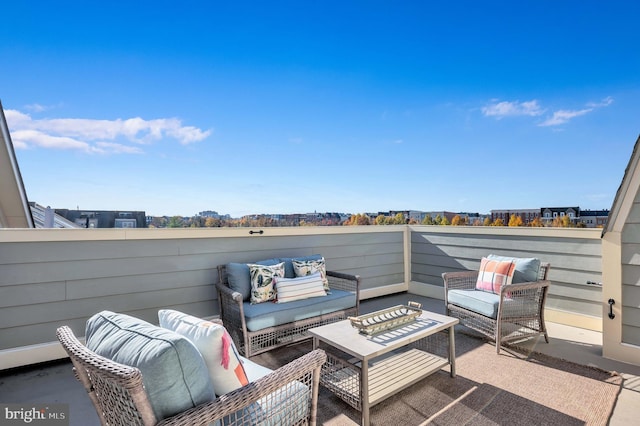 view of patio featuring an outdoor hangout area and a balcony