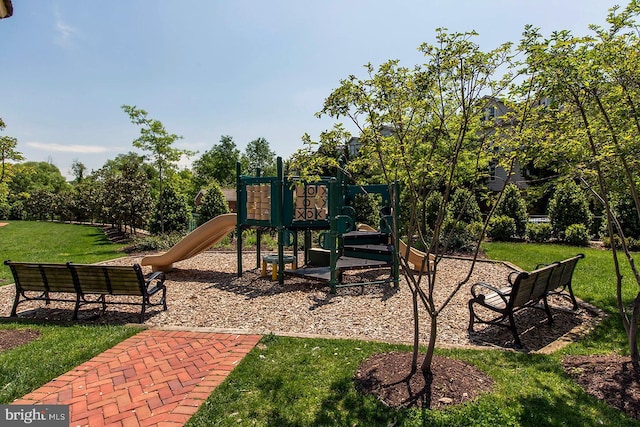 view of jungle gym with a lawn