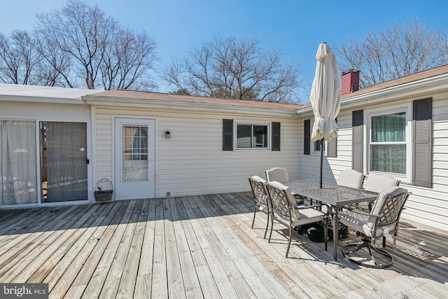 wooden deck with outdoor dining space