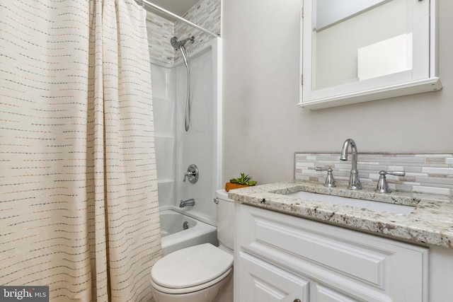 bathroom featuring backsplash, vanity, toilet, and shower / tub combo