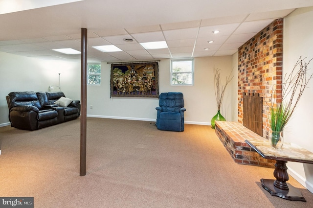 below grade area featuring recessed lighting, a drop ceiling, baseboards, and carpet