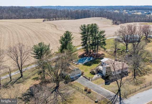 drone / aerial view featuring a rural view and a forest view