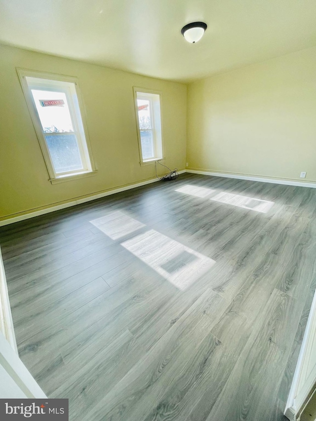 unfurnished room with light hardwood / wood-style flooring