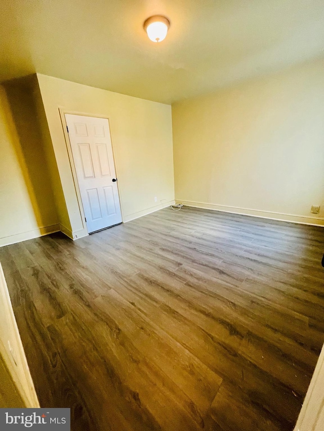 spare room with hardwood / wood-style floors