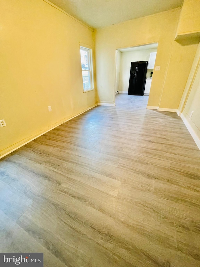 empty room featuring wood-type flooring