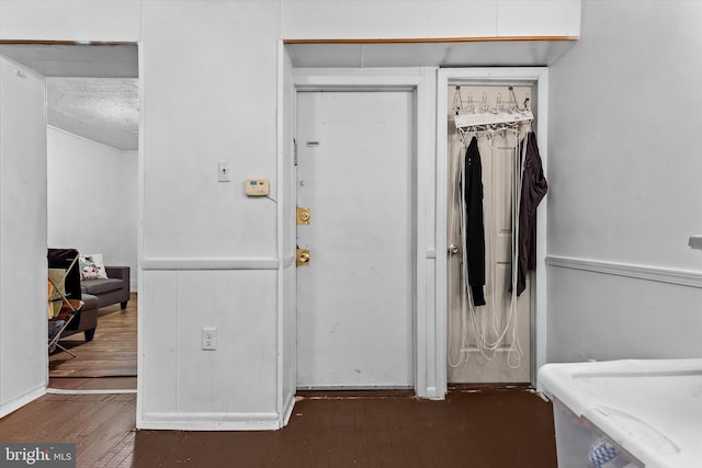 interior space with wood finished floors and a closet