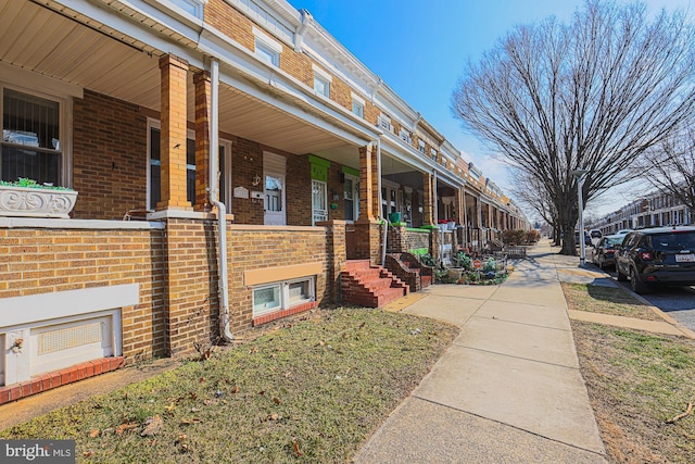 view of property exterior with a porch