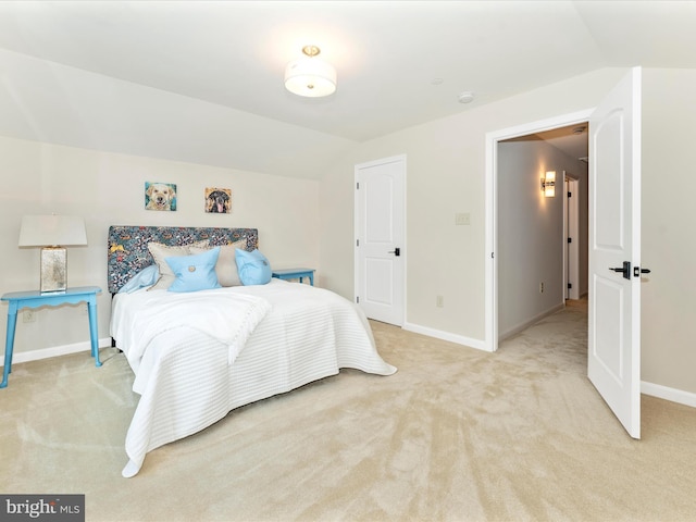 carpeted bedroom featuring vaulted ceiling