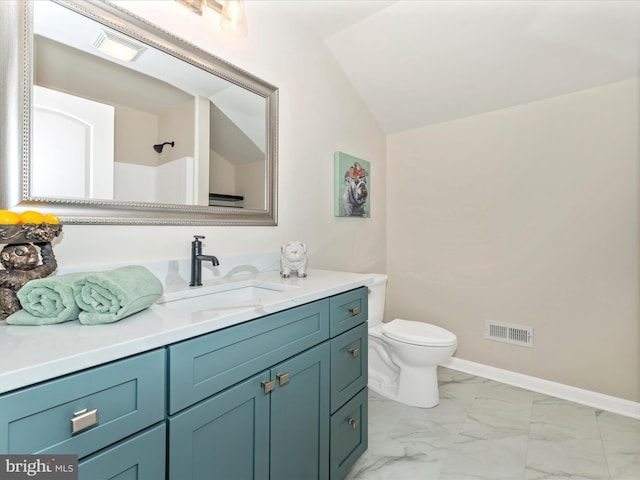 bathroom featuring vaulted ceiling, vanity, and toilet