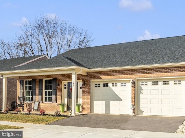 view of front of home with a garage and a porch