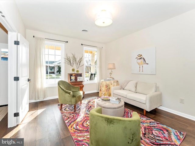 living room with dark hardwood / wood-style floors