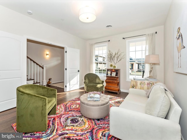 living room with dark hardwood / wood-style flooring