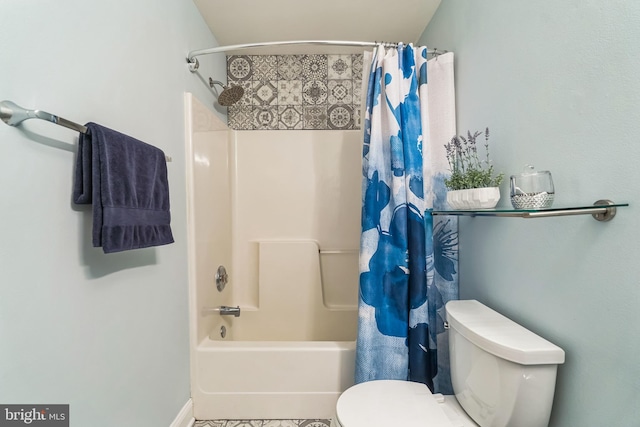 bathroom with shower / tub combo with curtain and toilet