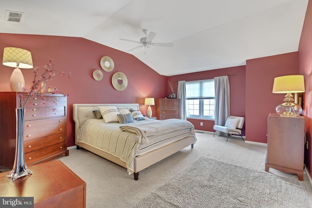 carpeted bedroom with vaulted ceiling and ceiling fan