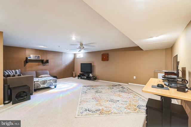 carpeted living room with ceiling fan