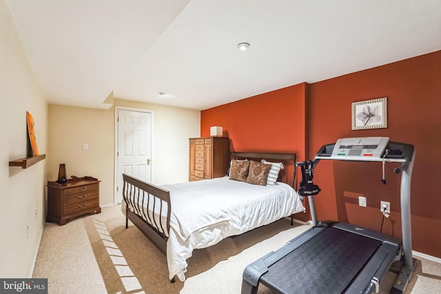 bedroom featuring light carpet