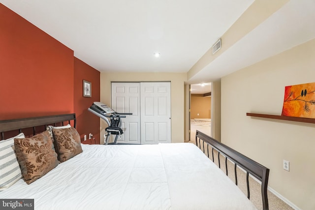 carpeted bedroom with a closet