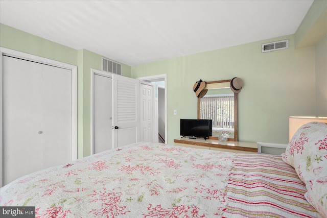 bedroom featuring visible vents