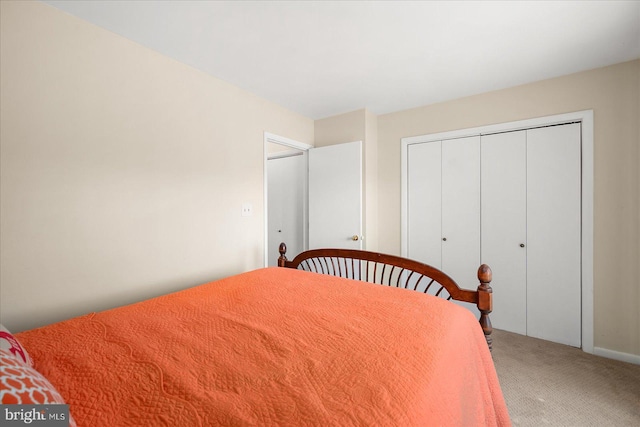 carpeted bedroom with a closet