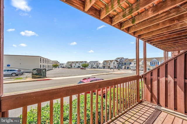 wooden deck with a residential view