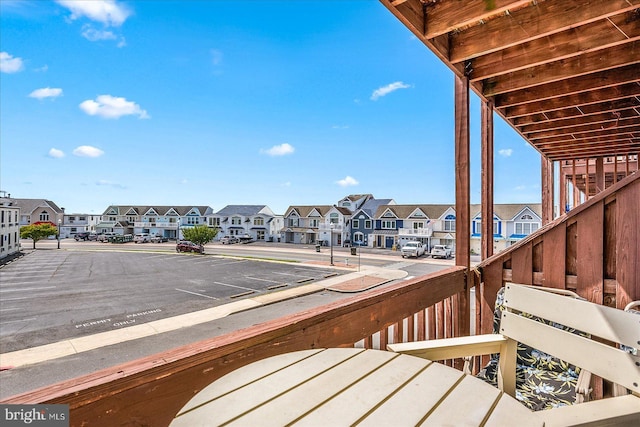 wooden deck featuring a residential view