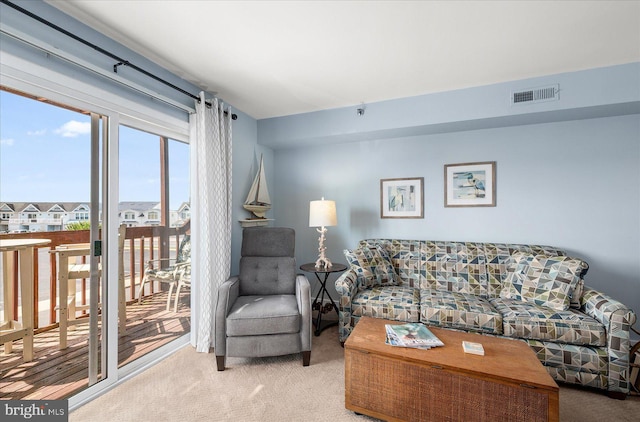 living room with light colored carpet