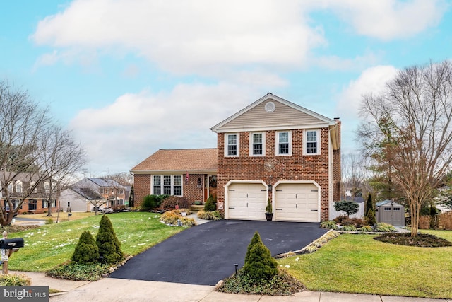 view of front of property featuring a garage, brick siding, a front yard, and driveway