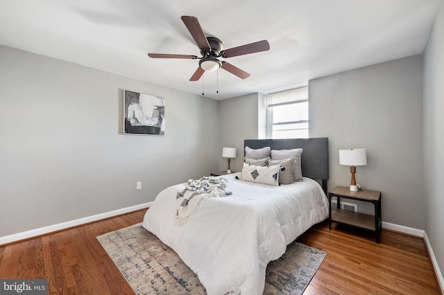 bedroom featuring hardwood / wood-style flooring and ceiling fan