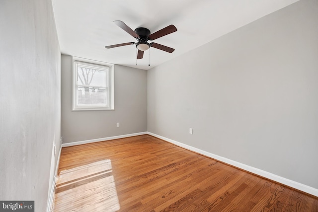 unfurnished room with ceiling fan and light hardwood / wood-style flooring