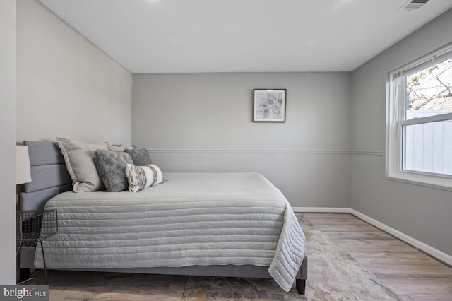 bedroom featuring wood-type flooring