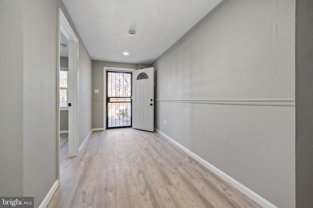 foyer entrance with light hardwood / wood-style floors