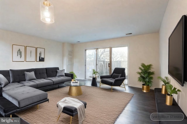 living room featuring dark wood-type flooring