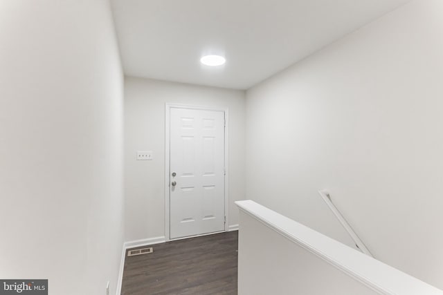 corridor featuring dark hardwood / wood-style floors