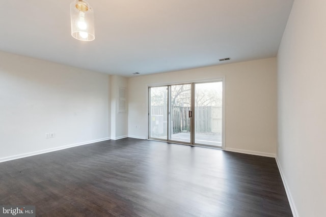 empty room featuring dark wood-type flooring