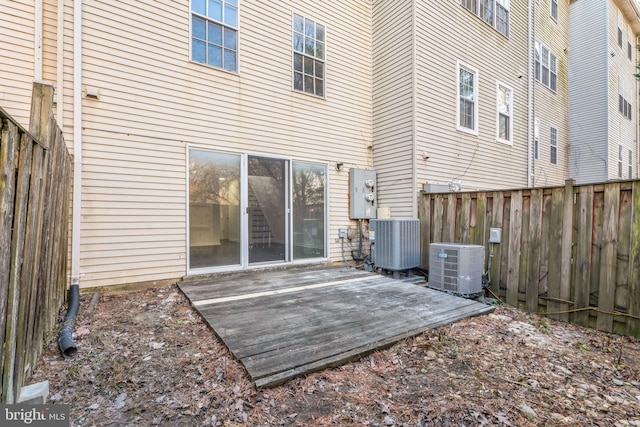 rear view of property with central AC and a patio area