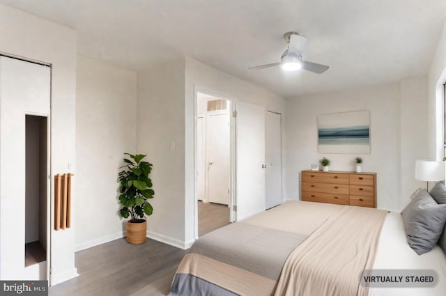 bedroom featuring ceiling fan and dark hardwood / wood-style flooring