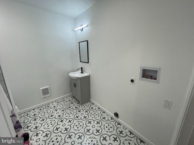 bathroom with tile patterned flooring, visible vents, baseboards, and vanity