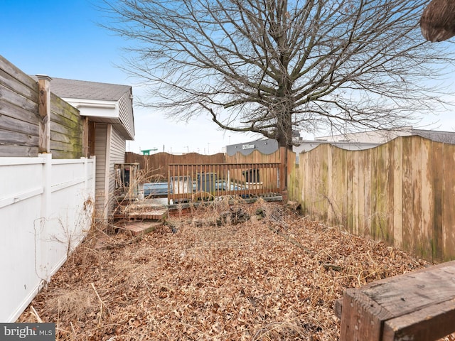 view of yard with a fenced backyard