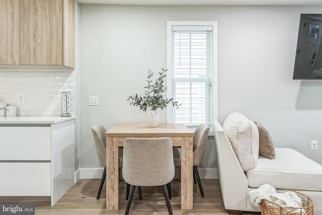 dining area with light wood-type flooring