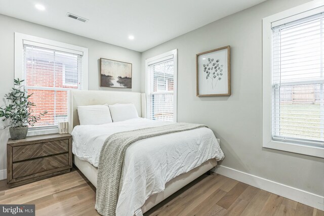 bedroom featuring hardwood / wood-style floors