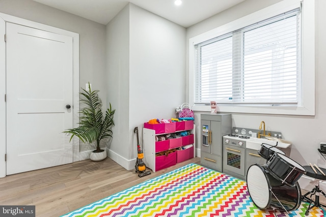 recreation room featuring light hardwood / wood-style flooring