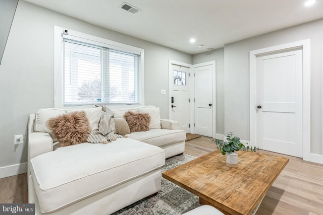 living room with light hardwood / wood-style floors