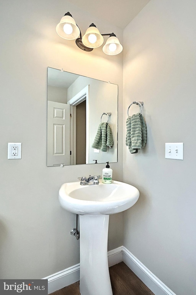 bathroom with hardwood / wood-style flooring