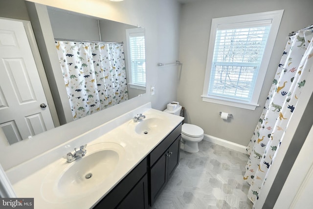 bathroom with vanity, toilet, and a shower with shower curtain