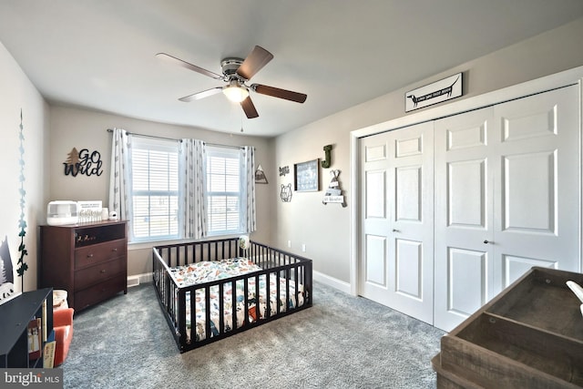 bedroom with ceiling fan, carpet floors, and a closet