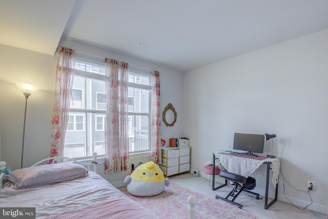 bedroom featuring light colored carpet