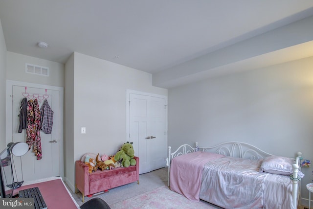 bedroom featuring light colored carpet