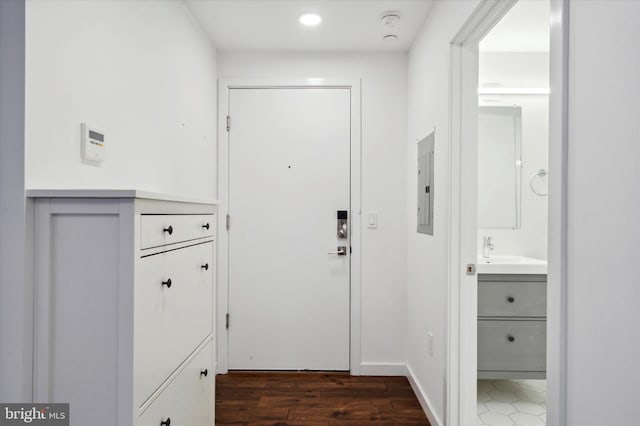 1501 N 31st St Unit 205, Philadelphia, PA 19121 - doorway to outside with a sink, electric panel, baseboards, and dark wood-type flooring